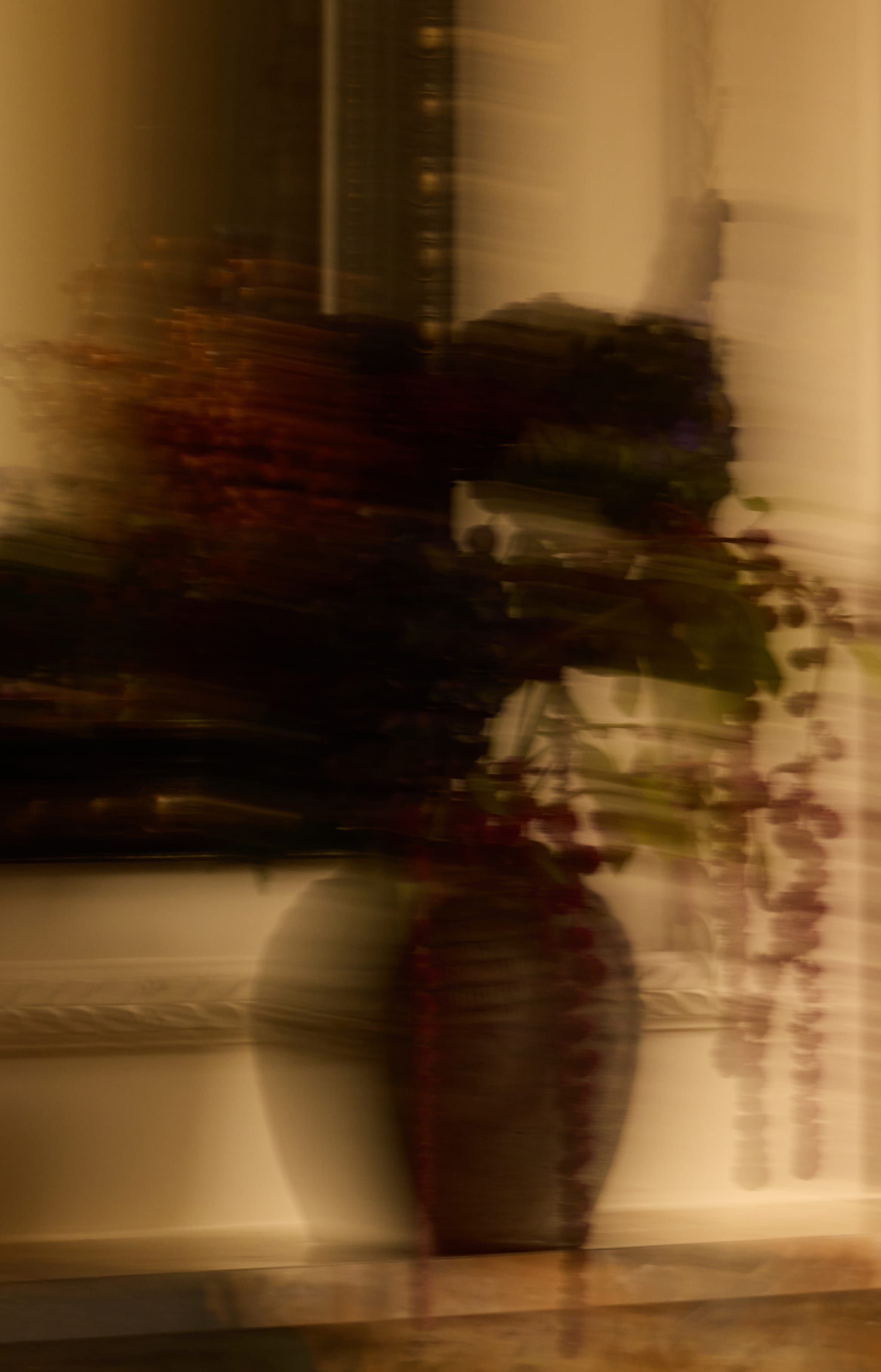 Blurred still life with a dark vase
