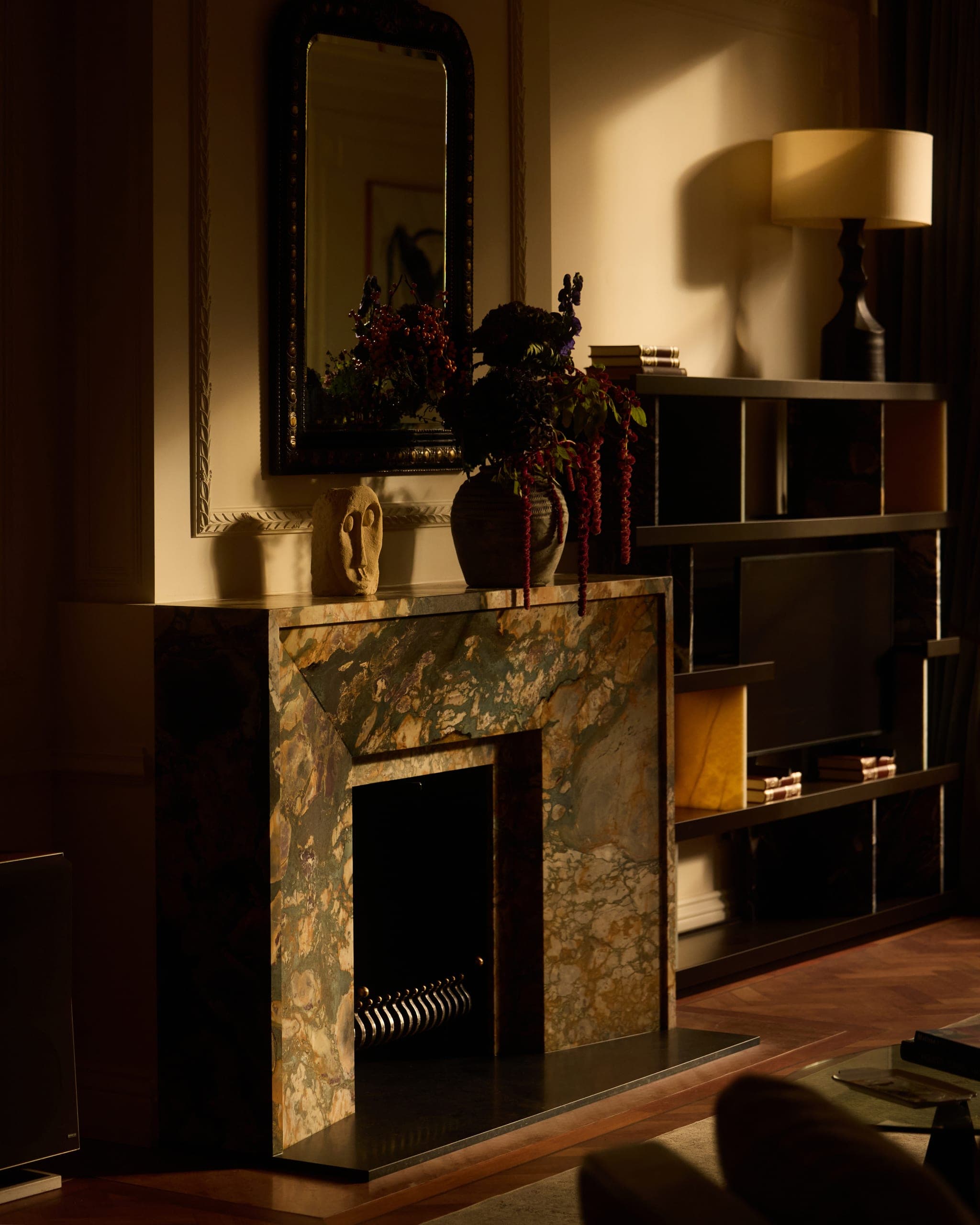 Candlelit interior with marble fireplace